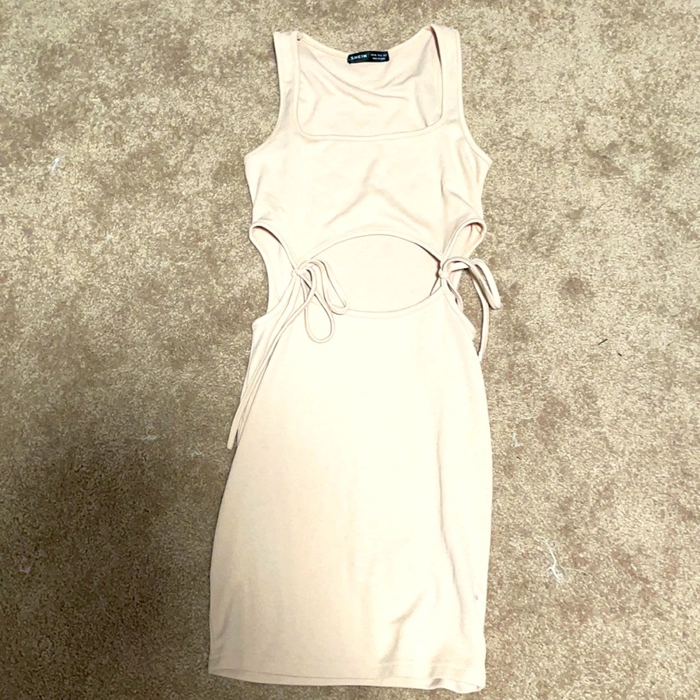 Cute dress never worn with rib cut outs